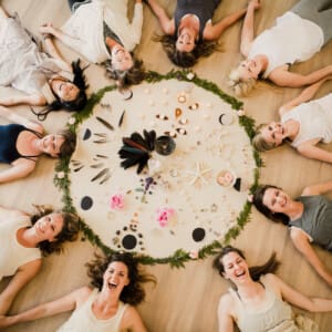 woman around circle on floor in wellness retreat